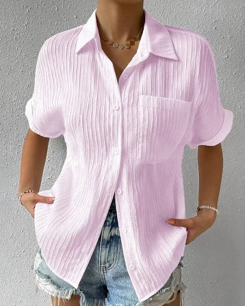 Zara | Effen gekleurde blouse met korte mouwen en een zak