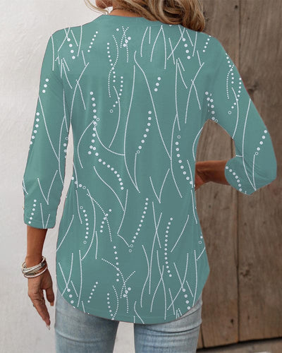 Zoë | Elegante geprinte blouse met knoopjes en een V-hals