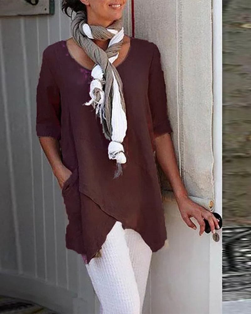 Elin | Asymmetrische blouse in één effen kleur.